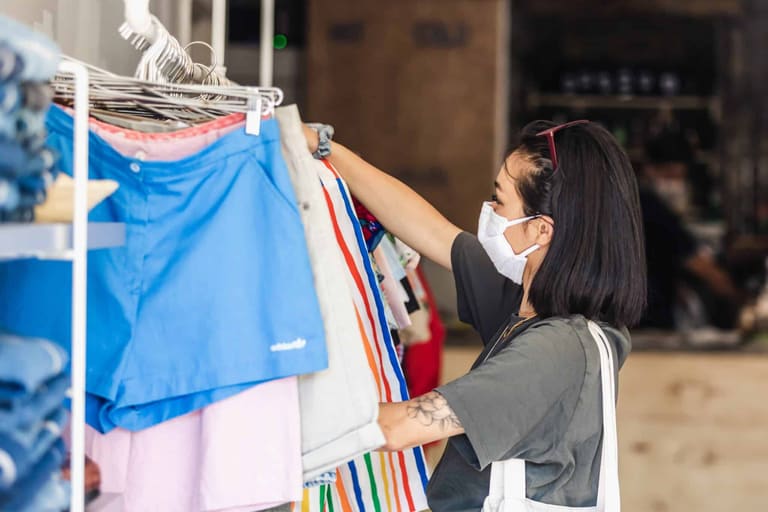 woman-shops-with-her-face-mask-in-place