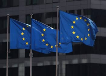 FILE PHOTO: European Union flags fly outside the European Commission headquarters in Brussels