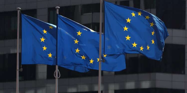 FILE PHOTO: European Union flags fly outside the European Commission headquarters in Brussels