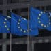 FILE PHOTO: European Union flags fly outside the European Commission headquarters in Brussels