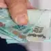 Notas de reais em destaque relacionadas ao Saque Calamidade do FGTS de R$ 6.220 liberado para novas cidades.