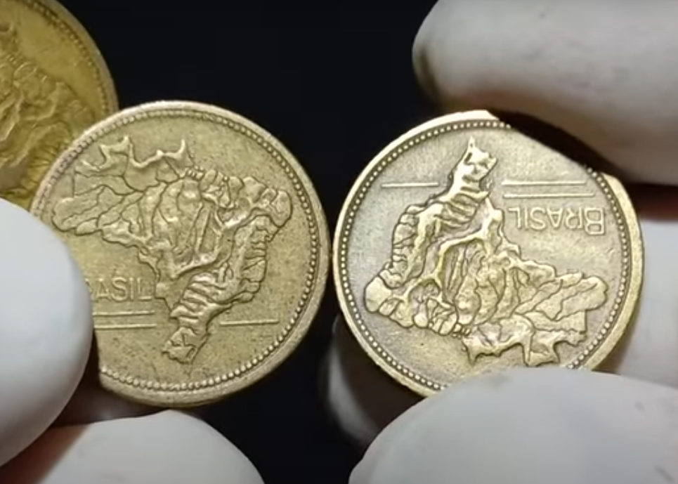 Moeda rara com o mapa do brasil invertido pode valer até 1000 reais Duas moedas de 1 cruzeiro mostrando o mapa do brasil, uma delas com o mapa invertido