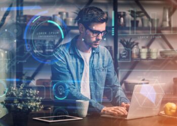 Homem interagindo com interface de dados de inteligência artificial em seu computador.