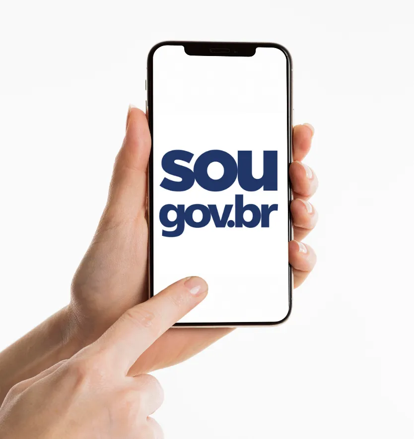 Imagem de celular exibindo o logo do portal sou.gov.br, indicando a realização do procedimento da prova de vida. 