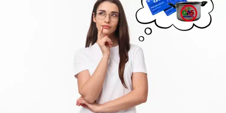 Mulher pensativa imaginando se o CPF irregular pode impedir o recebimento do benefício Gás do Povo.