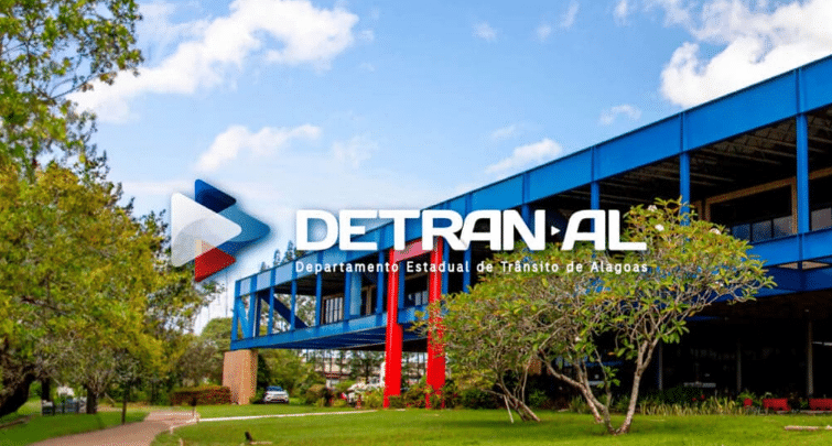 Concurso Detran-AL 2025 — 100 vagas anunciadas Fachada do prédio do Detran de Alagoas em um dia ensolarado.