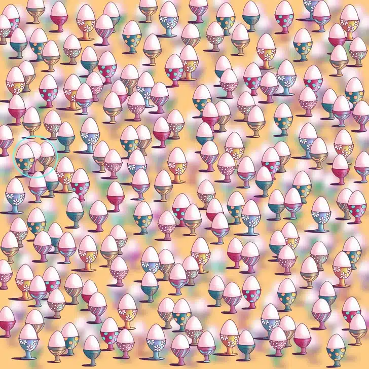 Desafio dos Ovos de Páscoa Coloridos Desafio visual com vários ovos de Páscoa coloridos em suportes decorados com flores e bolinhas sobre fundo amarelo desfocado