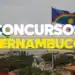 Bandeiras do Brasil e de Pernambuco tremulando sobre a vista de Olinda e Recife. Imagem de destaque para o Concurso Público Unificado PE 2026.
