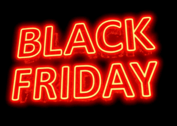 Letreiro em neon vermelho com as palavras “Black Friday” sobre fundo preto.