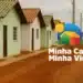 Imagem do programa Minha Casa, Minha Vida com casas populares e o logo oficial do programa.