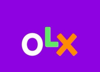 Várias cédulas de real brasileiro incluindo notas de 100 e 200 reais sobre fundo preto.