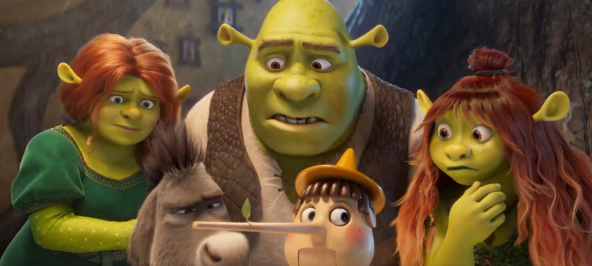 A Família Shrek e Amigos: Aventuras Inéditas a Caminho com o Novo Filme! Teaser do novo filme de Shrek. Família de ogros, Shrek, Fiona e os três filhos ogros (Felicidade, Fergus e Farkle), junto com Burro e Pinóquio, todos com expressões de surpresa ou preocupação, em uma cena da animação Shrek.