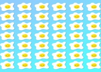 Teste visual com um padrão de ovos estrelados com gemas amarelas e rostos sorridentes em fundo azul