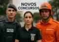 Três profissionais de segurança pública, policial militar, policial civil e bombeiro, posam juntos sob o texto 'Novos Concursos'