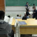 Estudantes universitários em sala de aula aguardando resultado do Sisu 2026.