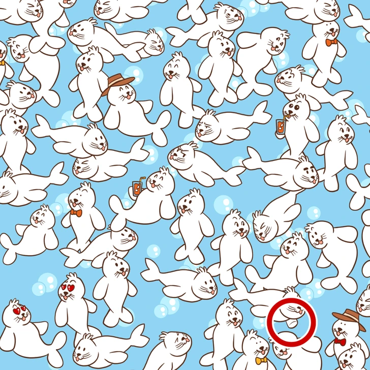 Encontre o marshmallow escondido entre as muitas focas. Desafio visual com focas ilustradas em um padrão repetitivo, sendo que algumas usam acessórios.
