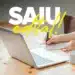 Pessoa escrevendo em caderno ao lado de notebook em mesa de madeira com texto Saúde Edital em destaque
