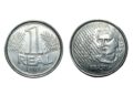 Visão detalhada das duas faces da primeira moeda de 1 real do Brasil, lançada em 1994. À esquerda, o reverso com o número 1 sobre ramos de louro; à direita, o anverso exibindo a efígie da República e a palavra "Brasil" sobre um fundo branco.