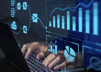 Painel digital com gráficos e indicadores sendo analisados por profissional no setor público.