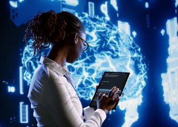 Profissional de inteligência artificial codificando em um ambiente tecnológico avançado, com gráficos de IA ao fundo.