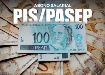 Notas de 100 reais brasileiras com o logo do Abono Salarial PIS/Pasep, representando a liberação do benefício em março.