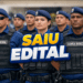 Grupo de guardas municipais uniformizados em posição de formação com expressão séria