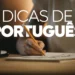 Mão escrevendo com lápis com texto Dicas de Português sobreposto