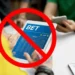 Pessoa usando tablet com site de apostas exibindo a palavra BET e símbolo de proibição indicando restrição para endividados