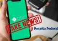 Celular exibindo Pix com aviso de fake news e referência à Receita Federal sobre fiscalização
