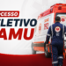 Profissional do SAMU de costas, uniformizado em azul, caminhando em direção à ambulância vermelha e branca