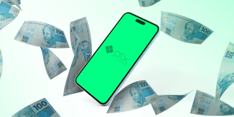Smartphone com logo do Pix cercado por notas de 100 reais.