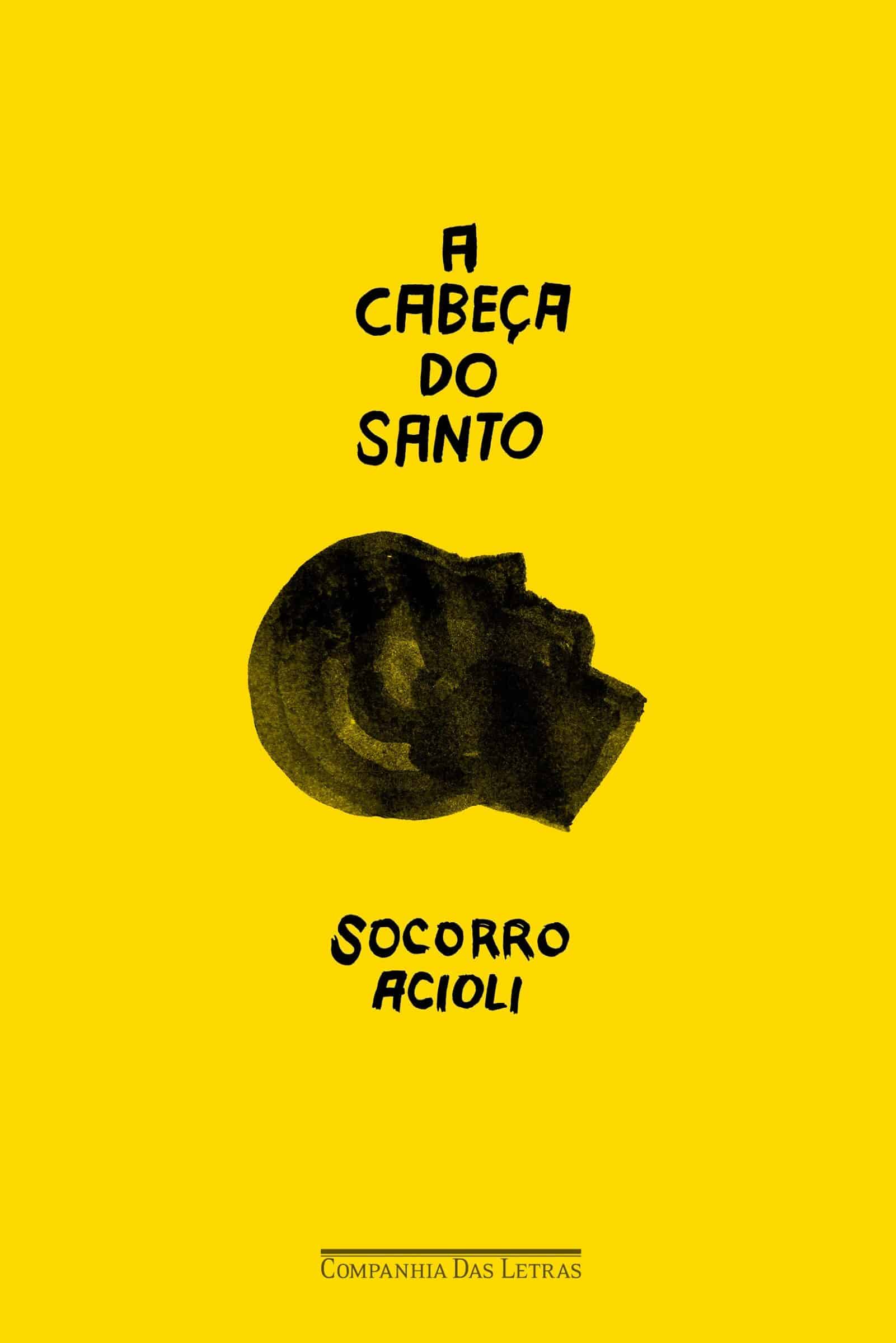 Capa amarela com cabeça de santo escura, título em tipografia manual e selo Companhia das Letras