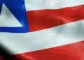 Bandeira da Bahia em destaque, usada para ilustrar a discussão sobre a preservação do “h” no nome do estado.