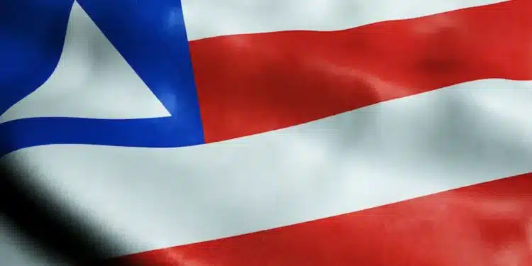 Bandeira da Bahia em destaque, usada para ilustrar a discussão sobre a preservação do “h” no nome do estado.