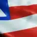 Bandeira da Bahia em destaque, usada para ilustrar a discussão sobre a preservação do “h” no nome do estado.