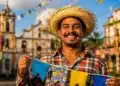Trabalhador brasileiro sorrindo em festa de São João, com bandeirinhas coloridas e chapéu de palha, representando a data comemorativa de São João.