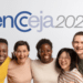 Cinco pessoas sorrindo, abraçadas sob o logo do Encceja 2026 em fundo claro.