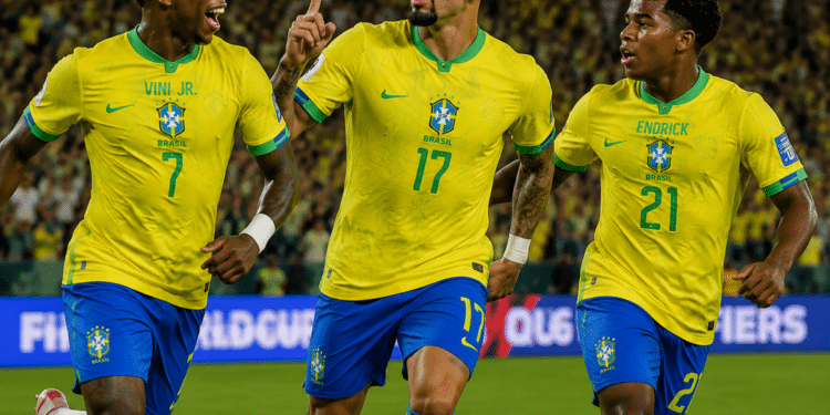Três jogadores da Seleção Brasileira comemoram gol vestindo uniformes amarelos com nomes Viní Jr., Paquetá e Endrick.