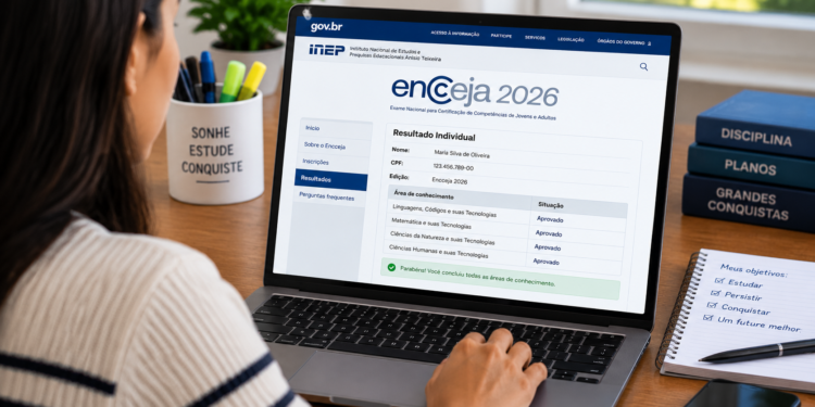 Mulher acessa notebook com tela mostrando aprovação no Encceja 2026, caneca motivacional e cadernos ao lado.